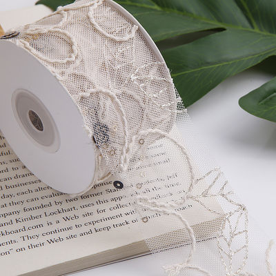 Cinturón de malla de poliéster brillante de 50 mm con cinta de jacquard floral